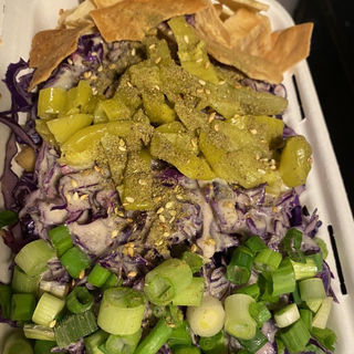 HOLLWOOD BOWL- Hollywood Bowl - Za'atar, lemon garlic tahini sauce, grilled garbanzo beans, red cabbage, pita chips, peperoncinis and scallions on a bed of jasmine rice.