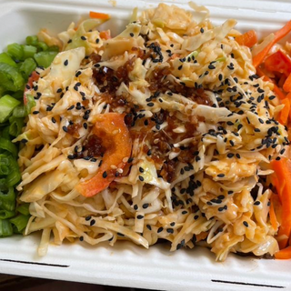 ALBINA BOWL - Teriyaki marinated chik'n, peanut ginger sauce, cilantro, roasted garlic cloves, spinach, carrots, scallions and toasted sesame seeds on a bed of jasmine rice.