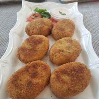 Beef filled Potato Chop: Beef cooked in savory blend of spices and enrobed in mashed potato. Breaded and fried to golden perfection. 2 in each order