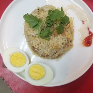 Chicken Biryani- Chicken cooked in mild spices with fragrant jasmine rice.